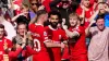 Liverpool’s Mohamed Salah (centre) is congratulated by his team mates after scoring the first goal of the game during the Pr