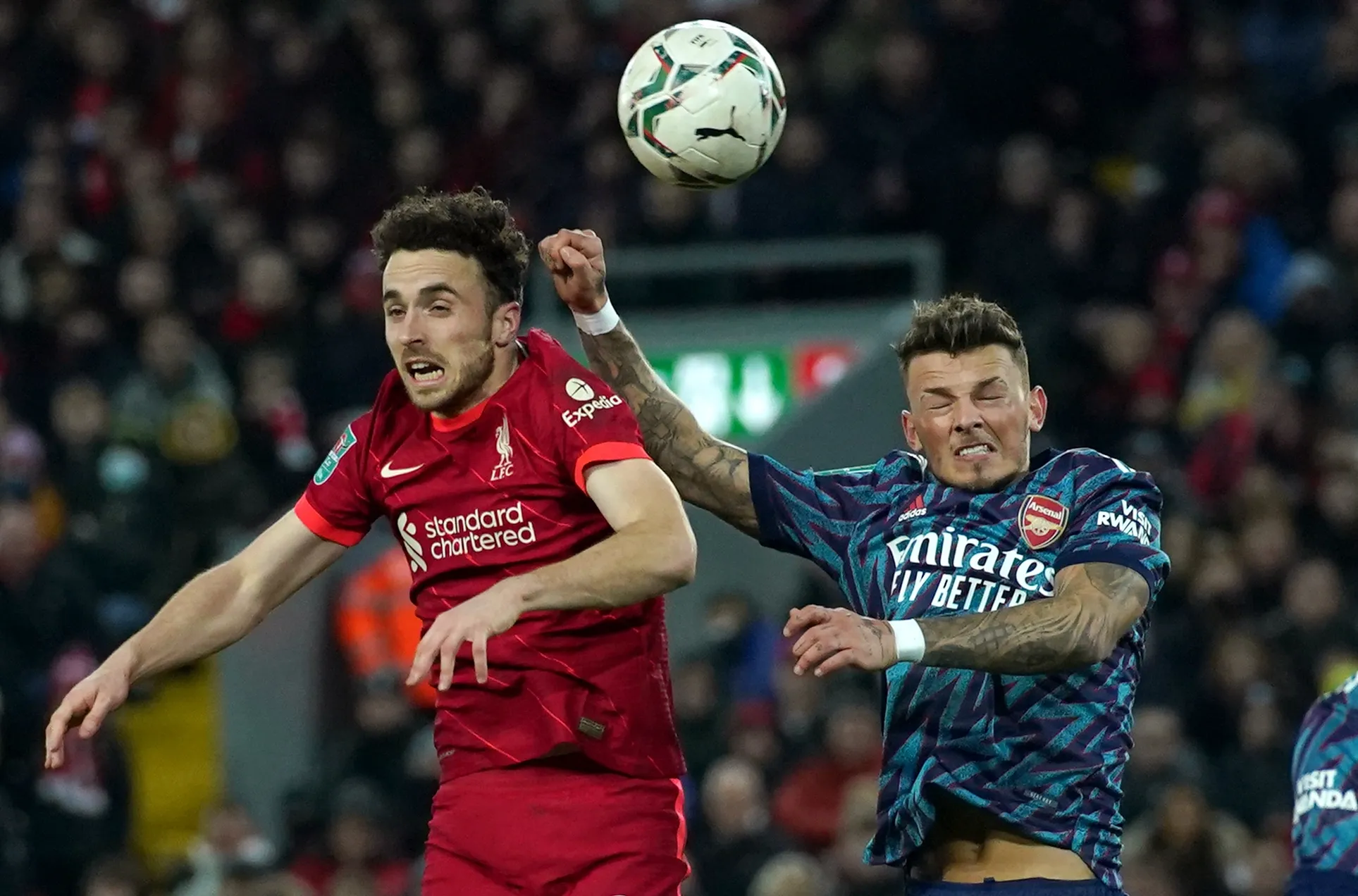 Arsenal's central defender Ben White challenges with Liverpool striker Diogo Jota