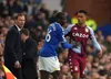 Everton midfielder Abdoulaye Doucoure in action whilst caretaker manager Duncan Ferguson looks on