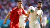 Wales defender Chris Mepham, left, battles for possession with Iran’s Mehdi Taremi during their World Cup clash on Friday (A