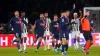 Paris Saint-Germain players surround referee Szymon Marciniak as they appeal for a penalty (Owen Humphreys/PA)