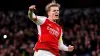 Arsenal captain Martin Odegaard celebrates after scoring the first penalty of the shoot-out win over Porto (Zac Goodwin/PA)