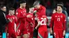 Daniel James is consoled by his Wales team-mates after missing from the spot in a penalty shoot-out against Poland (David Da