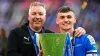 Harrison Burrows (right) and manager Darren Ferguson with the EFL Trophy (Adam Davy/PA)