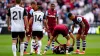 West Ham players come to the aid of team-mate George Earthy as he lies injured (Bradley Collyer/PA)