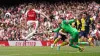 Arsenal’s Declan Rice and Bournemouth goalkeeper Mark Travers battle for the ball during the Premier League match at the Emi