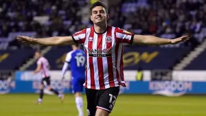 Sheffield United beat Wigan to cement second-place spot in the Championship