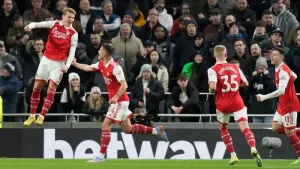 Arsenal extend Premier League lead to eight points with win at Tottenham