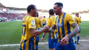 Shrewsbury march on to increase pressure on Oxford boss Karl Robinson