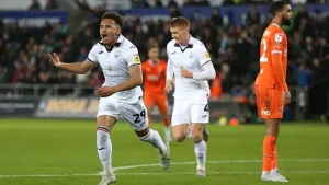 Swansea battle to victory over 10-man Blackpool