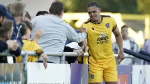 Coby Rowe scores stoppage-time equaliser for Sutton against 10-man Crewe