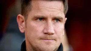 Crewe boss Lee Bell blasts missile-throwing fans after beating nine-man Tranmere