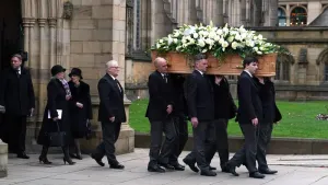 The coffin of Sir Bobby Charlton was carried by pallbearers out of Manchester Cathedral (Martin Rickett/PA)