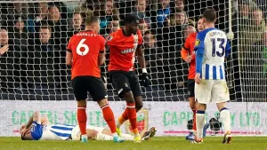 Elijah Adebayo’s hat-trick helps Luton to crushing win against Brighton
