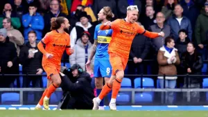 Ipswich beat 10-man AFC Wimbledon to book their place in the FA Cup fourth round