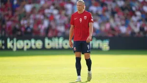 Manchester City’s Erling Haaland limps out of training while on duty with Norway