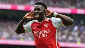 Arsenal withstand Tottenham’s second-half fightback to boost title hopes