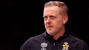 Garry Monk cuts relieved figure as Cambridge secure League One survival