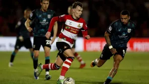 Kyle Hurst brings joy to Grant McCann in Doncaster’s win over Bradford