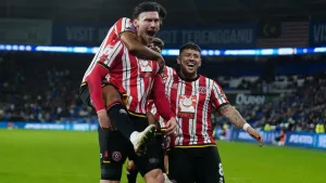Kieffer Moore’s double at Cardiff maintains Sheffield United’s three-point lead