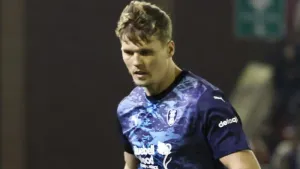 Sean Raggett heads in the winner as Rotherham beat Lincoln