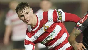 Rob Street on target as 10-man Doncaster edge lowly Morecambe to go third
