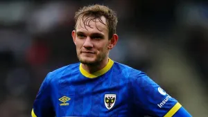 AFC Wimbledon bolster promotion bid with win at relegation-threatened Carlisle