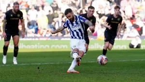 Adam Armstrong’s penalty proves enough as 10-man West Brom edge past QPR