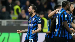 Hakan Calhanoglu, left, celebrates as Inter Milan moved four points clear (Luca Bruno/AP)