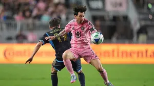 Inter Miami forward Lionel Messi controls the ball past Philadelphia Union midfielder Indiana Vassilev (AP/Rebecca Blackwell