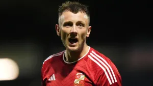 Ollie Clarke nets late leveller as Swindon deny 10-man Cheltenham in thriller