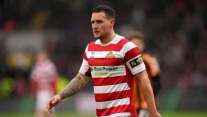 Doncaster clinch promotion after beating 10-man Bradford in incident-packed game