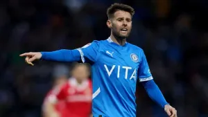 Stockport beat Huddersfield to clinch play-off spot