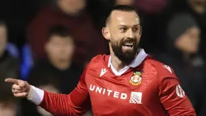 Wrexham strengthen grip on second place after overcoming 10-man Burton