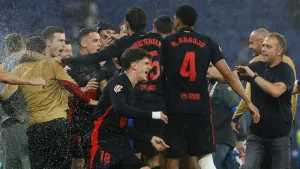 Barcelona clinch LaLiga title with victory at 10-man Espanyol