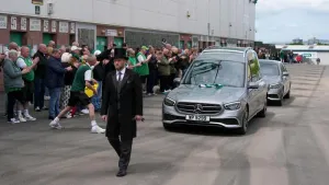 Fans applaud as Sir Tom Farmer’s hearse passes Easter Road
