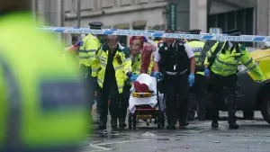 Man detained after car collides with pedestrians during Liverpool title parade