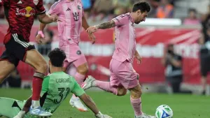 Inter Miami’s Lionel Messi, right, drives past New York Red Bulls goalkeeper Carlos Miguel Coronel to score (Frank Franklin 