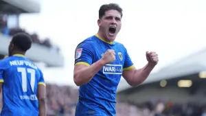 AFC Wimbledon off the mark with win over 10-man Lincoln