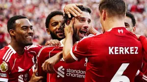 Liverpool’s Dominik Szoboszlai (centre right) celebrates scoring their winner (Peter Byrne/PA)