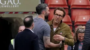 Ollie Palmer (centre) and Ryan Reynolds (right) at Wrexham’s SToK Cae Res. (Martin Rickett/PA)