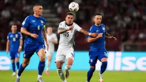 Serbia’s Nikola Milenkovic, left, under pressure from England’s Morgan Rogers (Bradley Collyer/PA)
