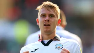 Ollie Cooper’s first Wigan goal earns point at Mansfield