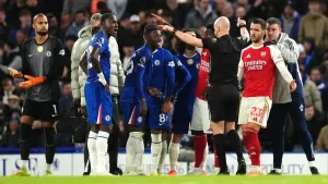 Ten-man Chelsea battle for a point against leaders Arsenal in fiery derby