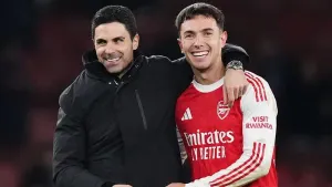 Mikel Arteta (left) and Martin Zubimendi celebrate Arsenal’s victory against Villa (John Walton/PA)