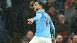 Rayan Cherki celebrates scoring the opener (Martin Rickett/PA)