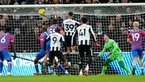 Bruno Guimaraes (top centre) heads Newcastle in front in the 2-0 win over Crystal Palace (Owen Humphreys/PA).