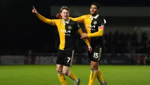 Burton stun Huddersfield to climb out of relegation zone