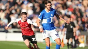 Jack Moylan, left, scored the only goal as Lincoln beat Wigan (Chris Radburn/PA)