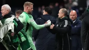 Celtic goalkeeper Kasper Schmeichel is congratulated by Shaun Maloney (Andrew Milligan/PA)